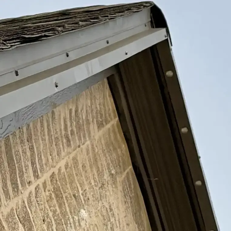Z-flashing track mount on a drip edge