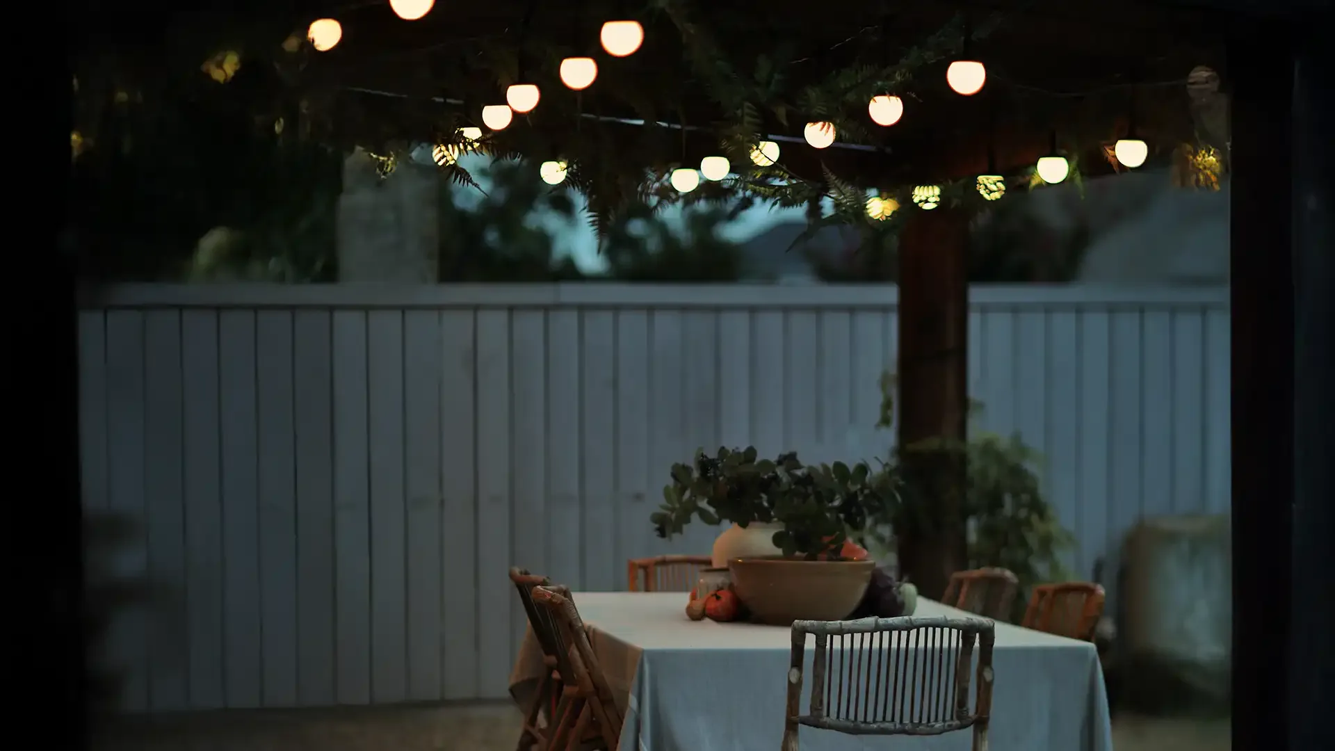 Happy's patio lights over a fire pit