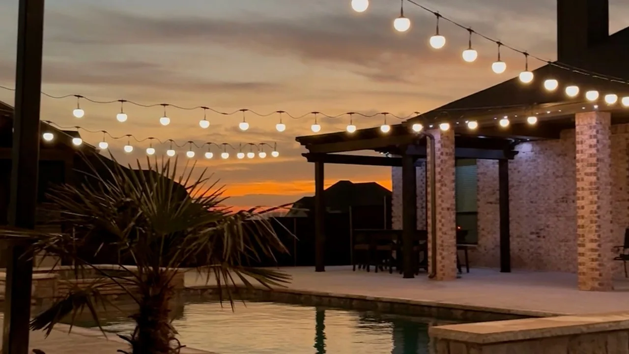 Happy's patio lights in blue over a deck