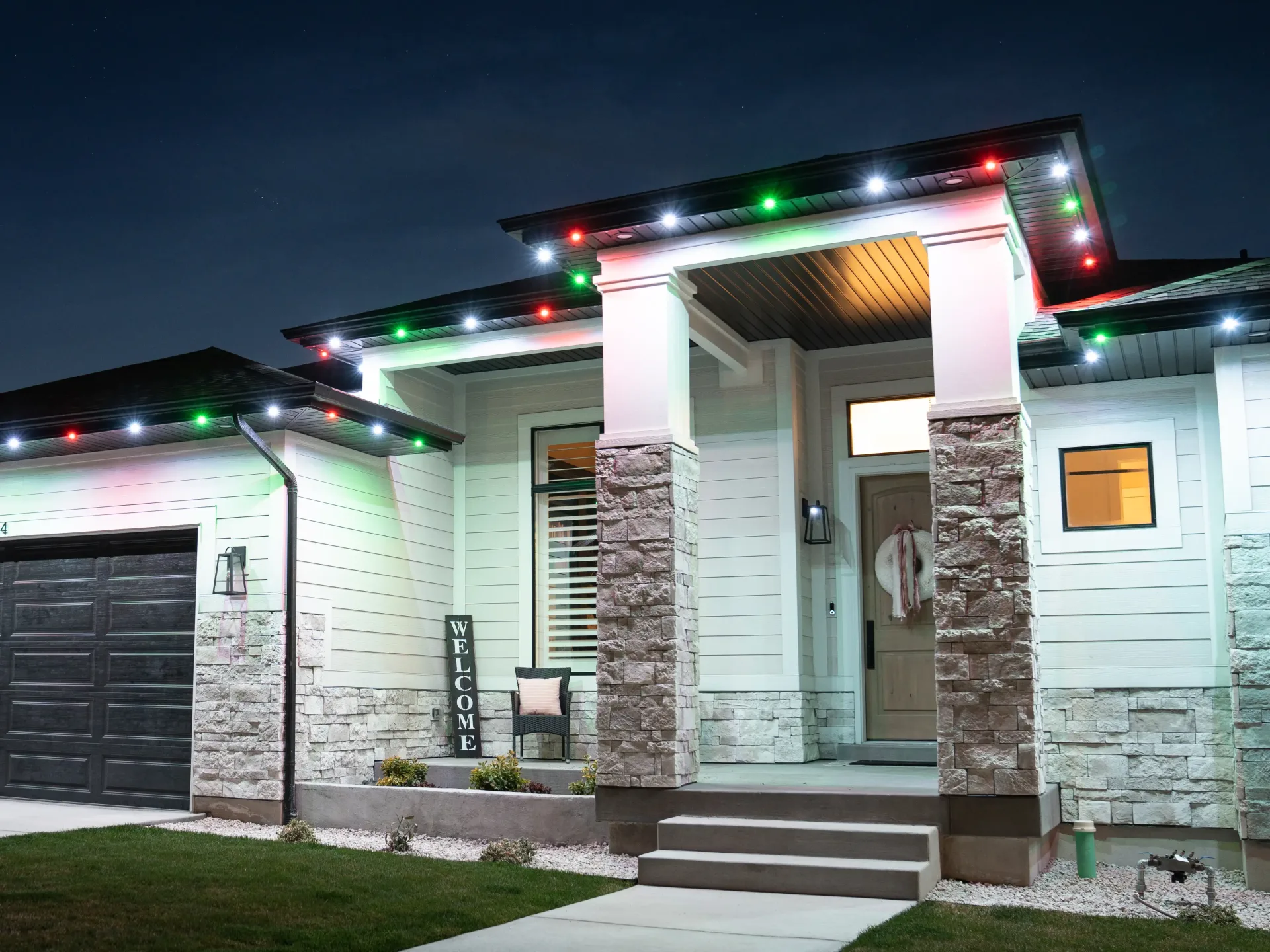 Home with icy blue and white holiday lights