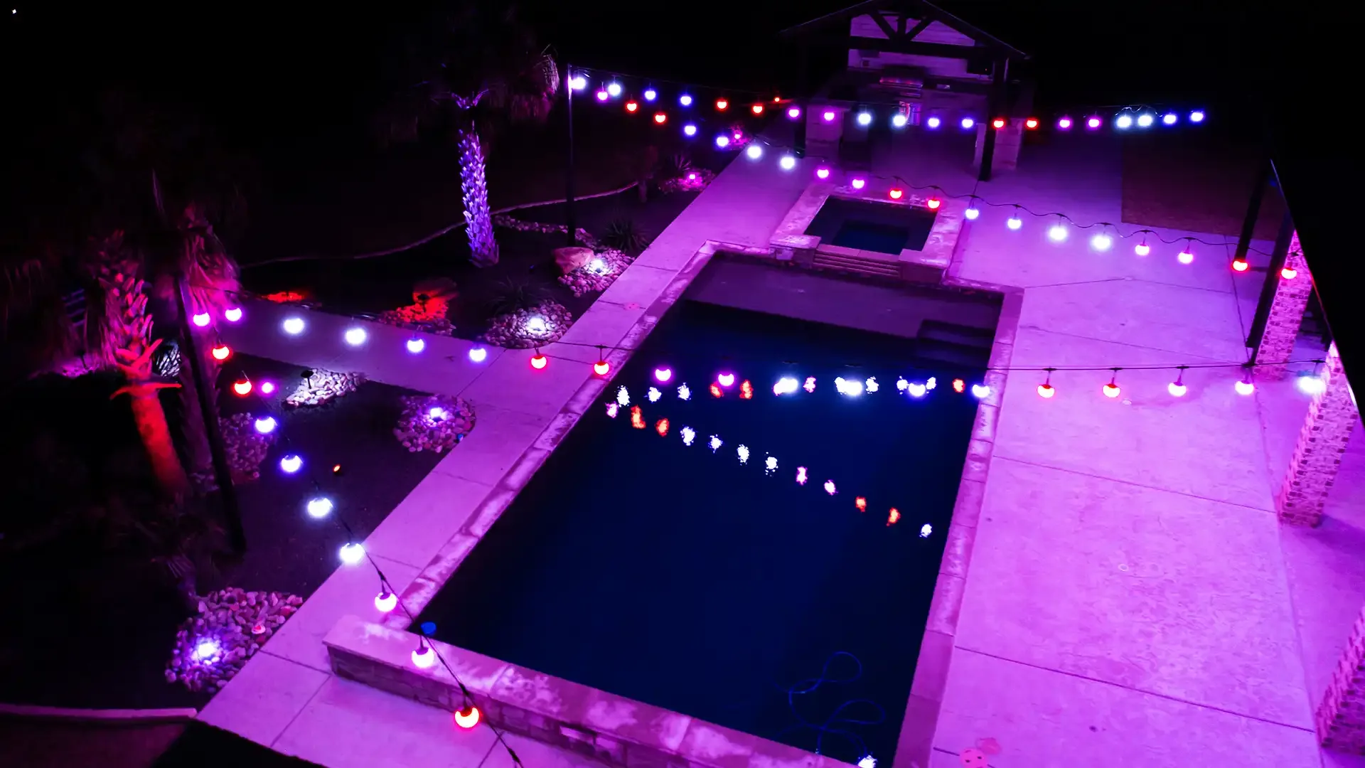 Happy's patio lights over a pool and patio