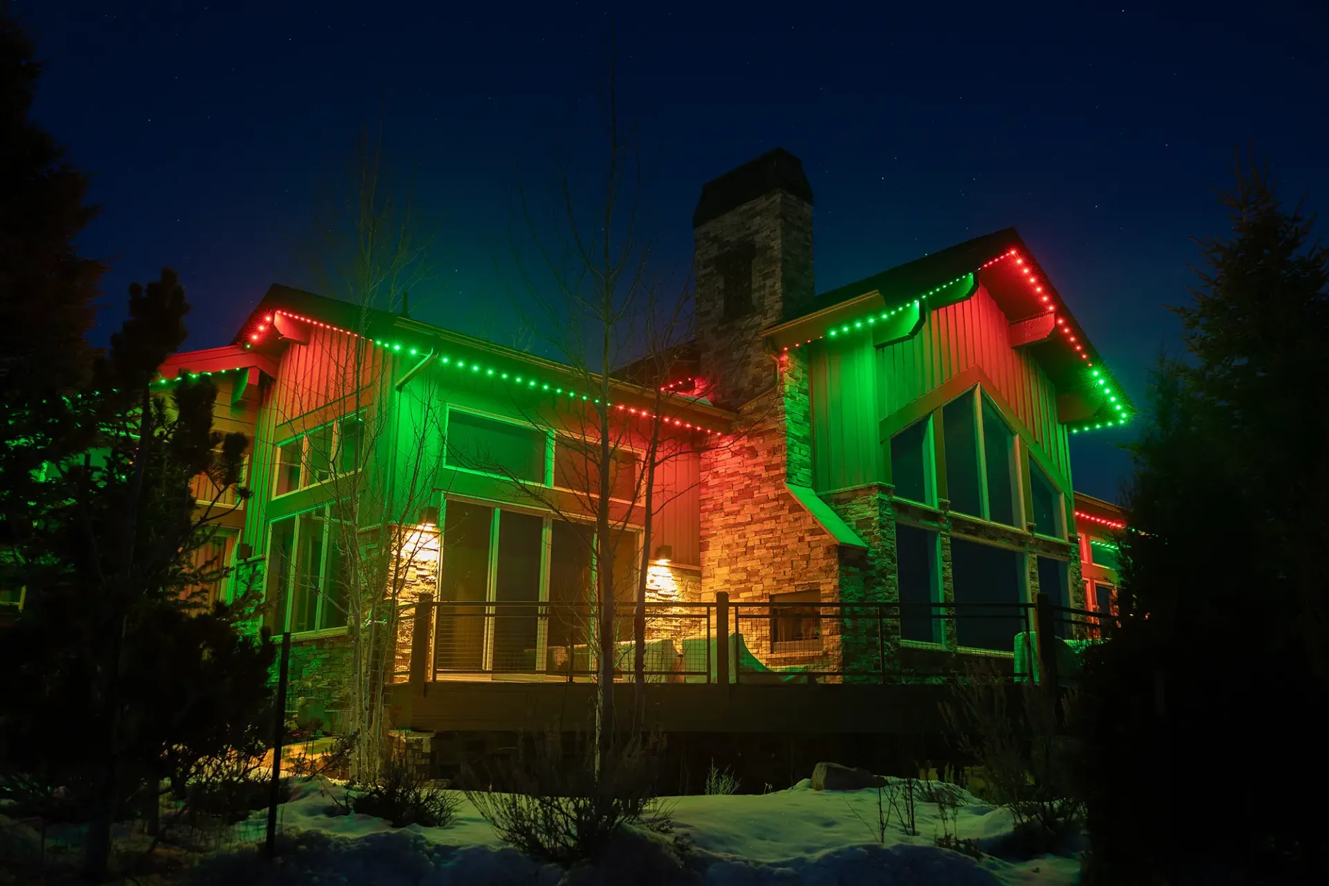 Home in green and red holiday lights