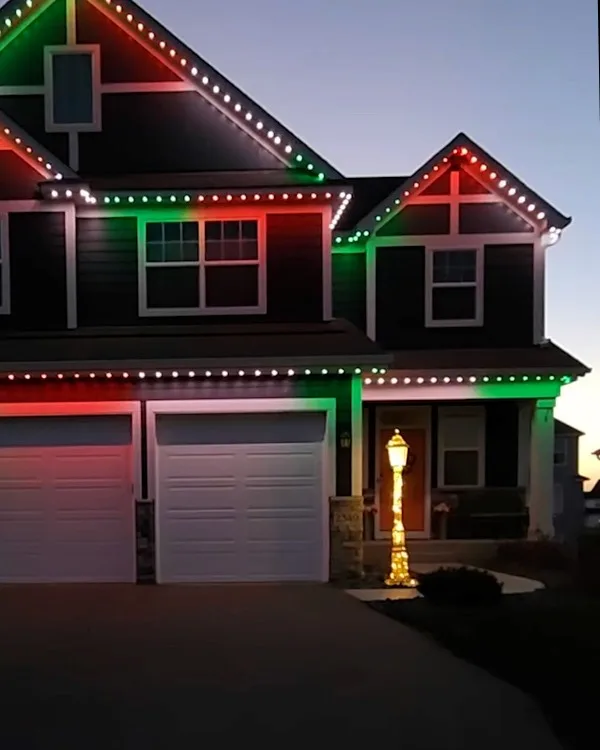 Home decorated with red, green and white permanent Christmas lights