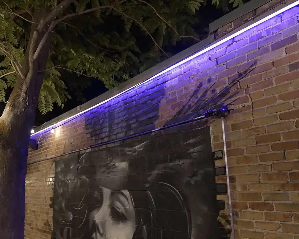 Purple wall wash from downward-facing Saber Series lights